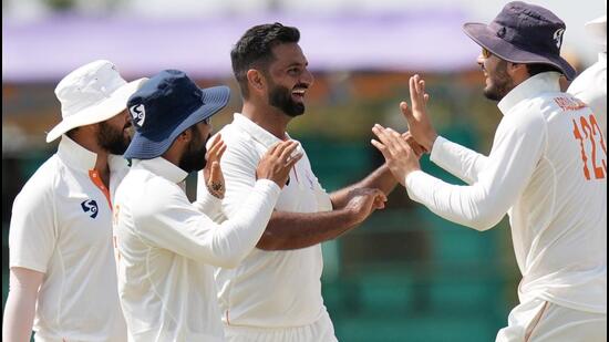 Jammu and Kashmir's Auqib Nabi celebrates the wicket of Karnataka's Mayank Agarwal on Day 4 of the Ranji Trophy in Hubballi on Friday. (PTI)