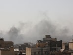 Smoke rises following an explosion, after Israel and the US launched strikes on Iran, in Tehran.