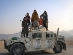 Pakistan-Afghanistan ‘war’ highlightes: Taliban soldiers pose as they stand on a Humvee, following exchanges of fire between Pakistani and Afghan forces, in Momand Dara, Nangarhar province, Afghanistan, February 28, 2026. 