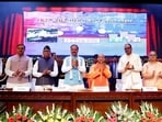 Chief minister Yogi Adityanath attends a programme under the Pradhan Mantri Ujjwala Yojana at Lok Bhavan. Deputy CMs Keshav Prasad Maurya and Brajesh Pathak, along with others, were also present. (HT PHOTO)