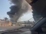 Smoke rises from the direction of the U.S. naval base after the state news agency reported missile attack on the service center of the U.S. Fifth Fleet, following strikes by the United States and Israel against Iran, in Manama, Bahrain.
