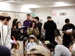 Israelis gather in a bomb shelter, after missiles were launched towards Israel from Iran following strikes by Israel and the US on Iran.
