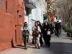 FILE PHOTO: People run for cover following an explosion, after Israel said it launched a pre-emptive attack against Iran, in Tehran, Iran February 28, 2026. 