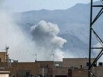 File: A plume of smoke rises following a reported explosion in Tehran on February 28, 2026. (Photo by AFP)