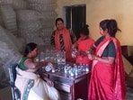 Namita Singh (in salwar suit) with fellow rural women at the bottle packaging plant in Jasra, Prayagraj (HT)