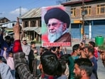 Pulwama: Agitators hold a portrait of Iran's Supreme Leader Ayatollah Ali Khamenei during a protest by Shia Muslims against the United States and Israel following reported attacks on Iran. (PTI Photo)(PTI02_28_2026_000381A)