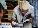 A voter checks his name in the list after the Election Commission published West Bengal's post-SIR electoral rolls, in Kolkata on Saturday, Feb 28, 2026.