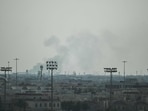 Smoke rises from an area in the direction of Al Udeid Air Base, which houses the Qatar Emiri Air Force and foreign forces including the US, in Doha on February 28, 2026, following a reported Iranian strike.