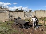 Syrian children inspect the wreckage of an Iranian rocket that was reportedly intercepted by Israeli forces in the southern countryside of Quneitra, near the Golan Heights, close to the town of Ghadir al-Bustan. The United States and Israel launched strikes against Iran on February 28, with Israel's public broadcaster reporting that Supreme Leader Ayatollah Ali Khamenei had been targeted, as the Islamic republic retaliated with barrages of missiles at Gulf states and Israel.