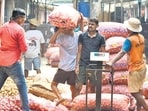 The Maharashtra Rajya Mathadi, Transport and General Kamgar Union has issued a stern ultimatum: from March 1, workers will refuse to unload any sack weighing more than 50 kg and will stop work if the limit is violated. (HT Photo)