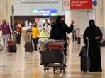 Travellers walk at Dubai Airport terminal 3, in the Gulf emirate of Dubai.