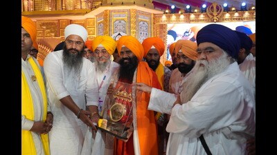 Swami Ramdev being felicitated on the occasion. (HT)