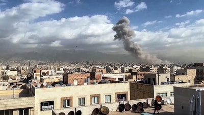 Smoke billows following the pre-emptive strike from Israel and the United States, in Tehran on Saturday. (ANI Video Grab)