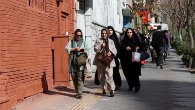 People run for cover following an explosion, after Israel said it launched a pre-emptive attack against Iran. (Reuters)