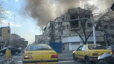 Smoke was seen rising from buildings in Iran after Israel, US carried out strikes on Saturday. (Sourced)