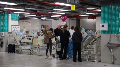 Patients are placed in a parking lot at Sourasky Medical Centre for safety after sirens sounded in Tel Aviv on February 28. (AFP)