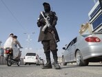A Taliban security personnel stands guard along a road in Kandahar on February 27, 2026, after overnight cross-border firing between Afghanistan and Pakistan.