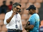 Sri Lanka's head coach Sanath Jayasuriya (R) speaks with commentator and former player Kumar Sangakkara at the Pallekele Cricket Stadium Sri Lanka's head coach Sanath Jayasuriya (R) speaks with commentator and former player Kumar Sangakkara at the Pallekele Cricket Stadium