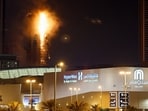 Smoke rises from a burning building hit by an Iranian drone strike, after Israel and the U.S. launched strikes on Iran, in Seef district, Manama, Bahrain.