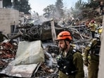 Emergency personnel work at the site of an Iranian strike, after Iran launched missile barrages following attacks by the U.S. and Israel on Saturday, in Beit Shemesh, Israel March 1, 2026.