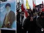 Demonstrators carrying pictures of late Iran’s Supreme Leader Ayatollah Ali Khamenei mourn during a protest against Israel and the U.S. strikes on Iran, following the killing of Khamenei, near the Israeli consulate in Istanbul, Turkey.