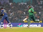 Pakistan's Shadab Khan, right, is run out. 
