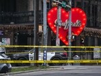 Police tape closes off the site of a shooting at Buford's in Austin, Sunday, March 1, 2026.  (Aaron E. Martinez/Austin American-Statesman via AP)