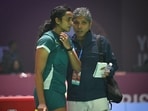 PV Sindhu seen along with her coach Irwansyah Adi Pratama as she competes during the Women's Single match against Nguyen Thùy Linh