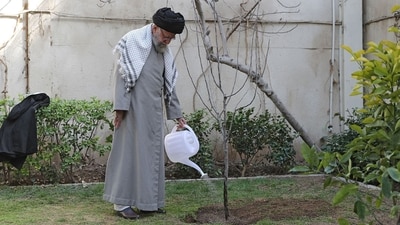Ayatollah Ali Khamenei, on March 6, 2023 watering a newly-planted tree in a garden during a ceremony marking the week of "Natural Resources" in Tehran. ((Photo by khamenei.ir / AFP) ) Ayatollah Ali Khamenei, on March 6, 2023 watering a newly-planted tree in a garden during a ceremony marking the week of "Natural Resources" in Tehran. ((Photo by khamenei.ir / AFP) )