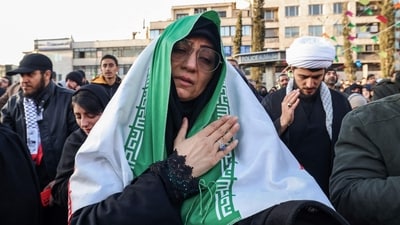 People mourn the death of Iran's supreme leader Ayatollah Ali Khamenei, who was killed in joint US and Israeli strikes, at a square in Tehran on March 1, 2026. Ayatollah Ali Khamenei, Iran's supreme leader since 1989 and sworn enemy of the West, was killed in the opening salvo of a massive US and Israeli attack that extended into a second day on March 1, as the two powers seek to topple the Islamic republic. (Photo by ATTA KENARE / AFP) (AFP) People mourn the death of Iran's supreme leader Ayatollah Ali Khamenei, who was killed in joint US and Israeli strikes, at a square in Tehran on March 1, 2026. Ayatollah Ali Khamenei, Iran's supreme leader since 1989 and sworn enemy of the West, was killed in the opening salvo of a massive US and Israeli attack that extended into a second day on March 1, as the two powers seek to topple the Islamic republic. (Photo by ATTA KENARE / AFP) (AFP)