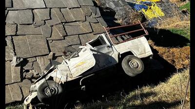 The mangled remains of the vehicle after it fell plunged off a road in Kullu on Sunday. (HT Photo)