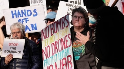 Protesters gather against the US bombing of Iran at Pike Place Market in Seattle on Saturday, Feb. 28, 2026. (Karen Ducey/The Seattle Times via AP) (AP) Protesters gather against the US bombing of Iran at Pike Place Market in Seattle on Saturday, Feb. 28, 2026. (Karen Ducey/The Seattle Times via AP) (AP)
