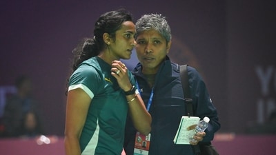 PV Sindhu seen along with her coach Irwansyah Adi Pratama as she competes during the Women's Single match against Nguyen Thùy Linh (Hindustan Times) PV Sindhu seen along with her coach Irwansyah Adi Pratama as she competes during the Women's Single match against Nguyen Thùy Linh (Hindustan Times)