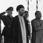 (FILES) President of the Islamic Republic of Iran Ayatollah Ali Khamenei (C), Pakistani President General Muhammad Zia-ul-Haq (R) and Prime Minister Mohammad Khan Junejo (2nd L), listen to the national anthems on January 13, 1986 upon Khamenei's arrival in Islamabad, Pakistan, where he is to sign an India-Pakistan trade agreement. US President Donald Trump announced on February 28, 2026, that Iran's supreme leader Ali Khamenei is confirmed dead. The United States and Israel launched strikes against Iran on February 28, with Israel's public broadcaster reporting that the Iranian supreme leader had been targeted, as the Islamic republic retaliated with barrages of missiles at Gulf states and Israel. (Photo by Ahmed ASHFAQ / AFP)