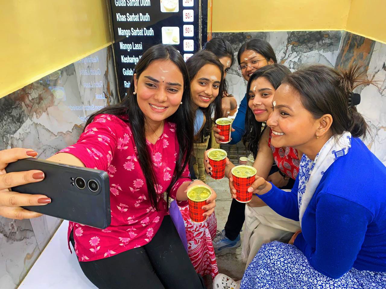 Youngsters enjoying thandai in Varanasi (Photo: Rajesh Kumar/HT) Youngsters enjoying thandai in Varanasi (Photo: Rajesh Kumar/HT)