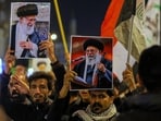 Iraqi Shiites hold pictures of Iranian Supreme Leader Ayatollah Ali Khamenei, who was killed by a U.S. airstrike in Tehran, during a symbolic funeral, in Najaf, Iraq, Sunday, March 1, 2026. (AP Photo/Anmar Khalil)