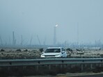 A car passes near QatarEnergy's LNG production facilities, amid the Iran war, in Ras Laffan Industrial City of Qatar on Monday, 2 March 2026.
