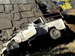 The mangled remains of the vehicle after it fell plunged off a road in Kullu on Sunday. (HT Photo)