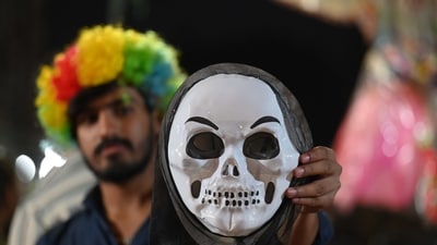Gram it: It's not just pichkaris and gulal on the Holi shopping list of Gurugrammers! Funky face masks are a hit for Holi festivities, this year too. At the Mandi in Khandsa Road, near Gurugram's HAFED Godown, a shopkeeper shows a horror mask that has become popular among buyers. (Photo: Parveen Kumar/HT) Gram it: It's not just pichkaris and gulal on the Holi shopping list of Gurugrammers! Funky face masks are a hit for Holi festivities, this year too. At the Mandi in Khandsa Road, near Gurugram's HAFED Godown, a shopkeeper shows a horror mask that has become popular among buyers. (Photo: Parveen Kumar/HT)