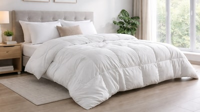 Lightweight cotton AC comforter layered on a neatly made bed in a cool, modern air-conditioned urban bedroom setting. (Ai generated) Lightweight cotton AC comforter layered on a neatly made bed in a cool, modern air-conditioned urban bedroom setting. (Ai generated)