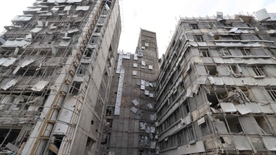 The damaged facade of the Gandhi Hospital, which was hit March 1, when a projectile struck a state TV communications tower and nearby buildings across the street, during the ongoing joint US-Israeli military campaign on the capital Tehran on March 2, 2026. The United States and Israel launched strikes against Iran on February 28, killing Iran's supreme leader and top military leaders, prompting authorities to retaliate with strikes on Israel and across the Gulf. (Photo by ATTA KENARE / AFP) (AFP)
