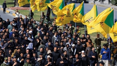 Mourners attend the funeral of members of the Iraqi armed group Kataib Hezbollah who were killed in an airstrike that targeted a Hashd al‑Shaabi headquarters near the western al‑Qaim district on the Syrian border, amid the U.S.-Israel conflict with Iran, in Baghdad, Iraq, March 2, 2026. REUTERS/Thaier Al-Suda (REUTERS)
