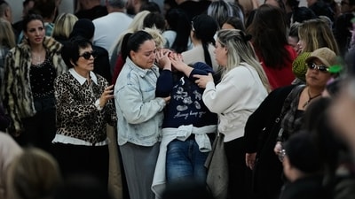 Mourners attend the funeral of Sarah Elimelech and her daughter Ronit who were killed in an Iranian missile attack, in Beit Shemesh, Israel, Monday, March 2, 2026. (AP Photo/Ohad Zwigenberg) (AP)