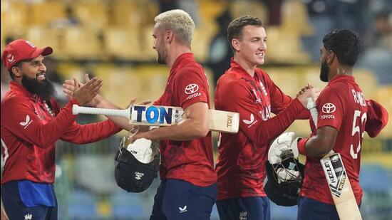 England's team celebrates after their win against New Zealand during the T20 World Cup. (AP)