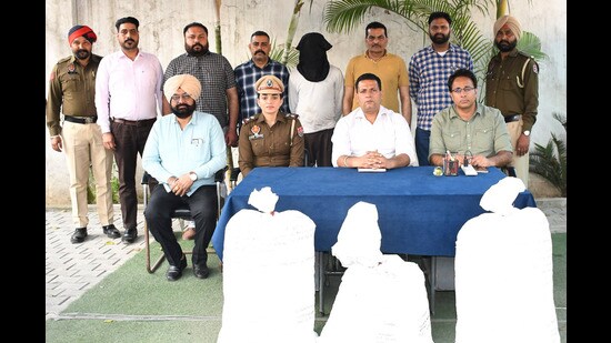 Police with arrested accused in Ludhiana on Monday. (HT Photo)