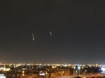 Missiles are seen in the skies over Doha on March 3, 2026. Qatar's military intercepted two ballistic missiles early in the morning of March 3, the country's defence ministry said in a statement. (AFP)