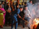 Residents observe 'Holika Dahan' at Shri Shiv Narayan Sidheshwar Mandir in Gurugram on Monday (HT)