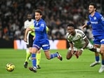 Getafe defender Juan Iglesias (R) fights for the ball with Real Madrid forward Vinicius Junior (C) during the Spanish league football match Getafe defender Juan Iglesias (R) fights for the ball with Real Madrid forward Vinicius Junior (C) during the Spanish league football match