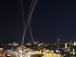 Rocket trails from an interception by Israel's Iron Dome missile defence system are pictured over Jerusalem on March 1, 2026. 