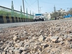 The road is also plagued by the heavy movement of MCD trucks carrying garbage and the stray cattle menace. (RAJ K RAJ /HT PHOTO)